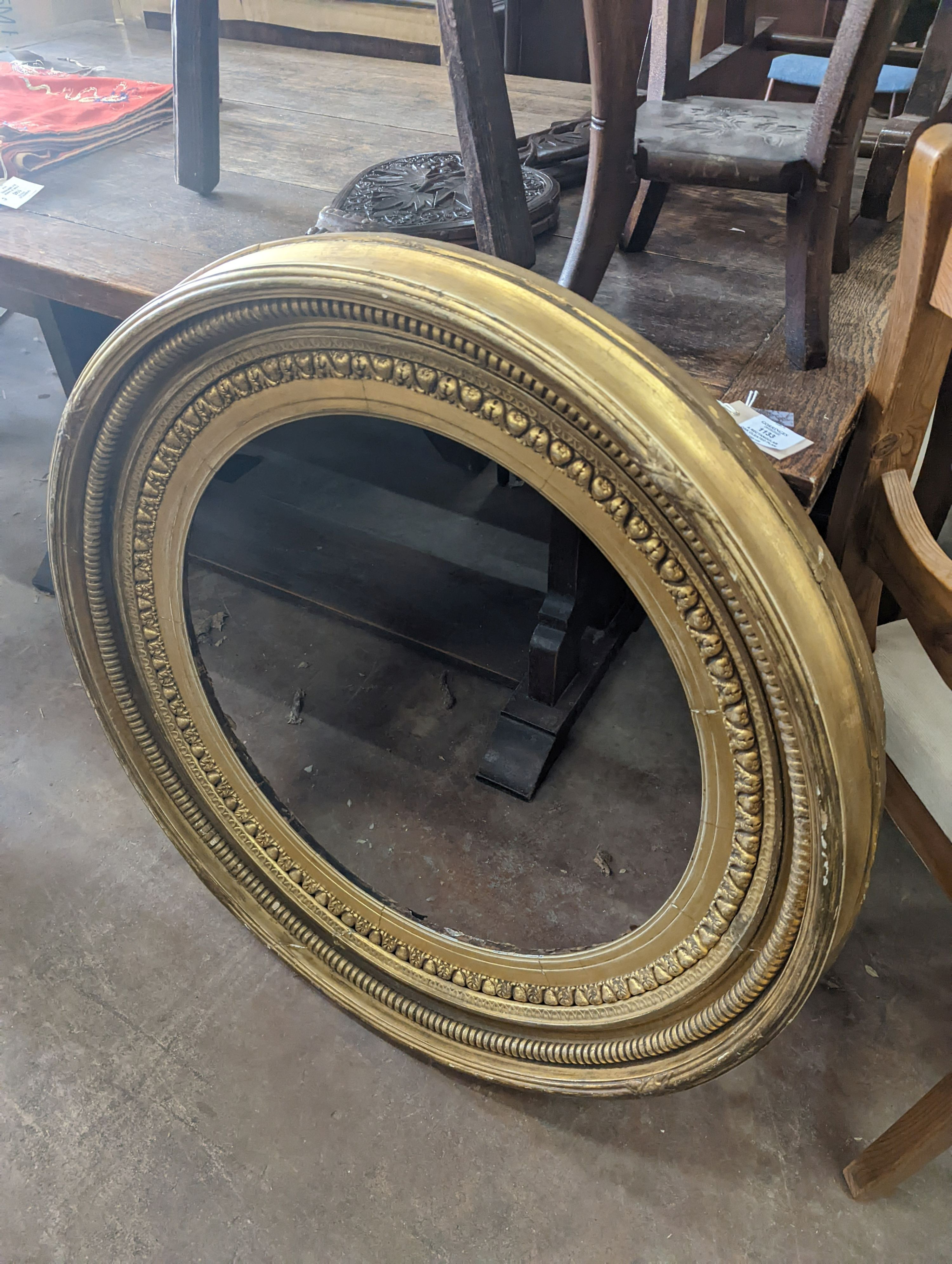 A large Regency circular giltwood and gesso convex wall mirror, diameter 86cm